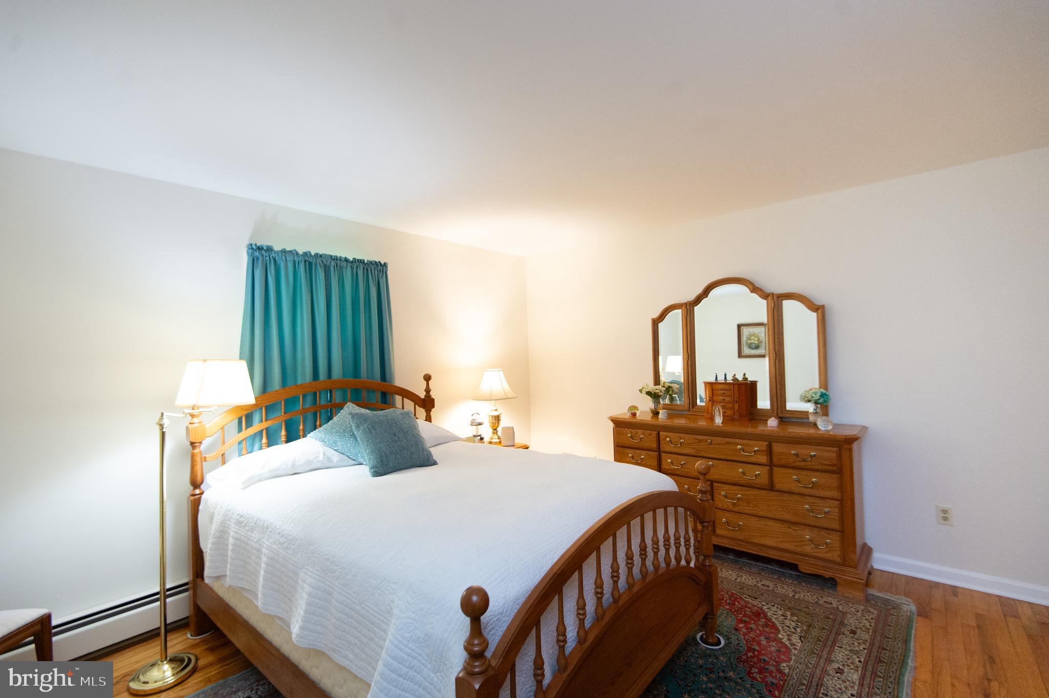 8 West Liberty Street Ridgely, MD 21660 - Photo 19 of 55 a bedroom with a bed and a dresser