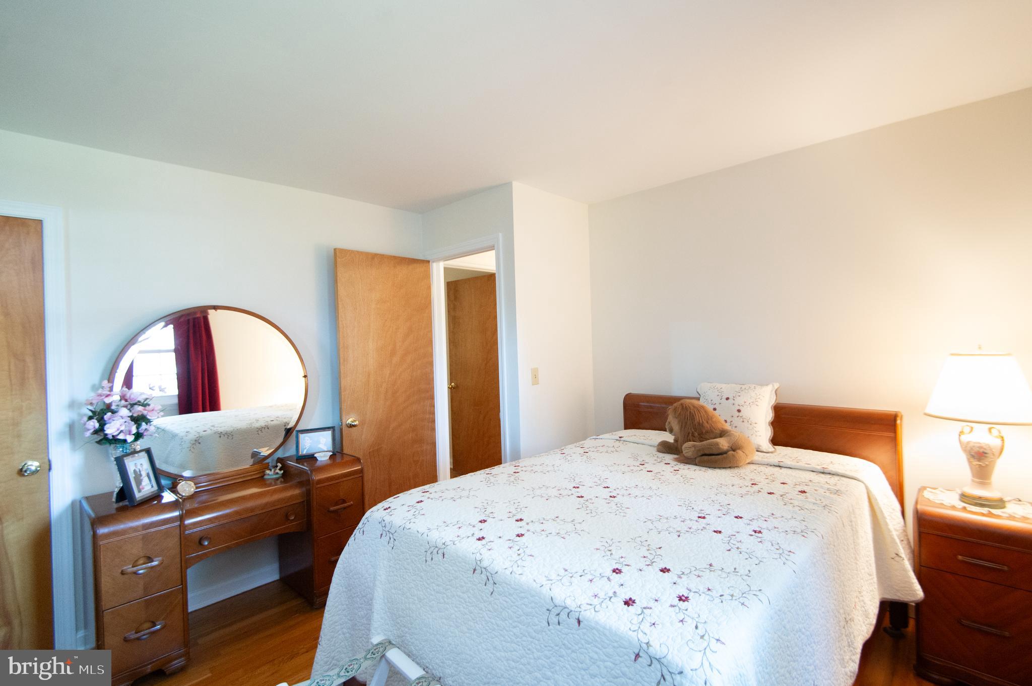 8 West Liberty Street Ridgely, MD 21660 - Photo 24 of 55 a bedroom with a bed and a large window