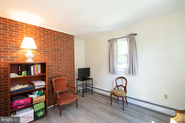 a kitchen with granite countertop white cabinets and stainless steel appliances