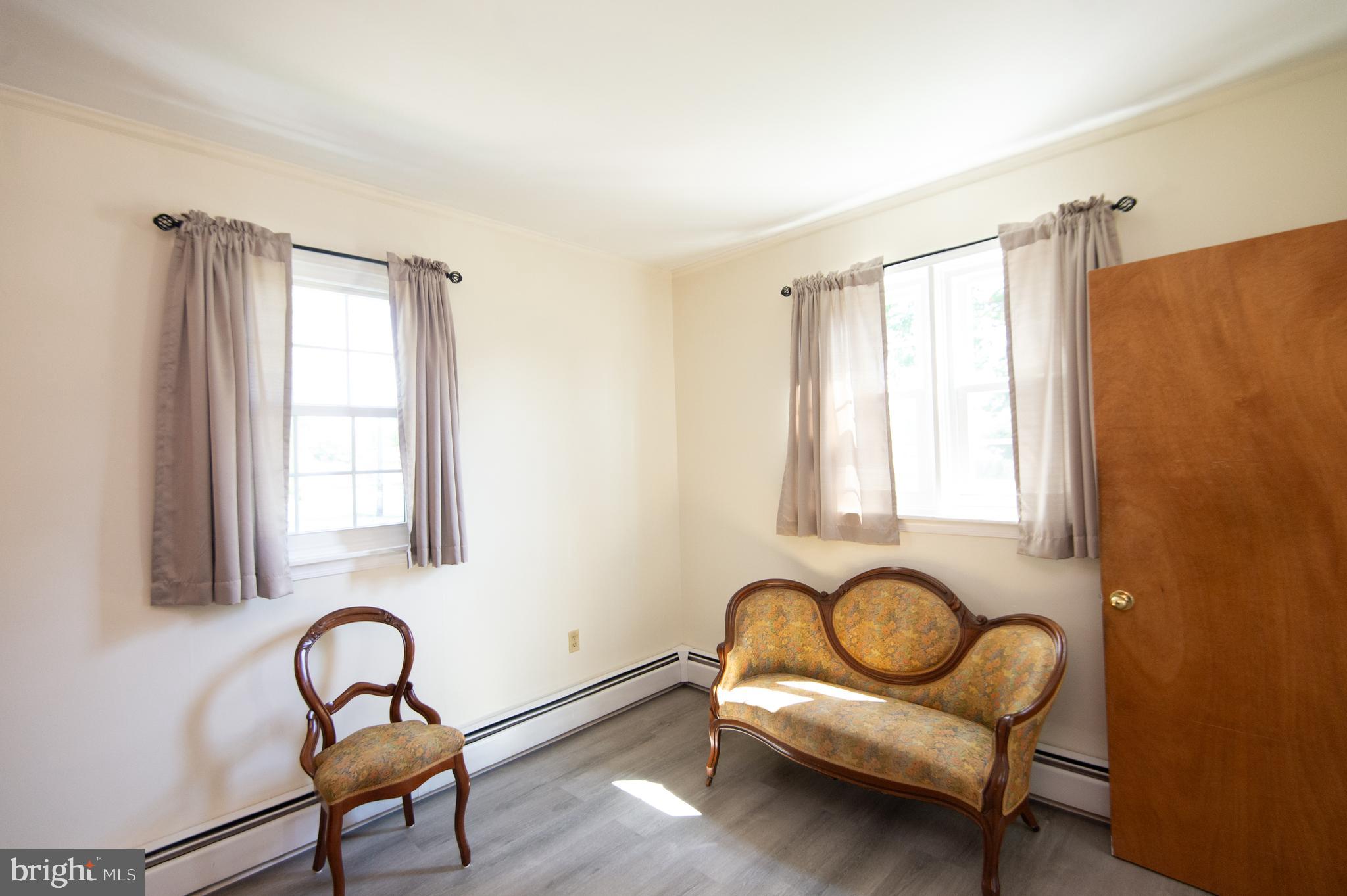 8 West Liberty Street Ridgely, MD 21660 - Photo 9 of 55 a living room with furniture and a window