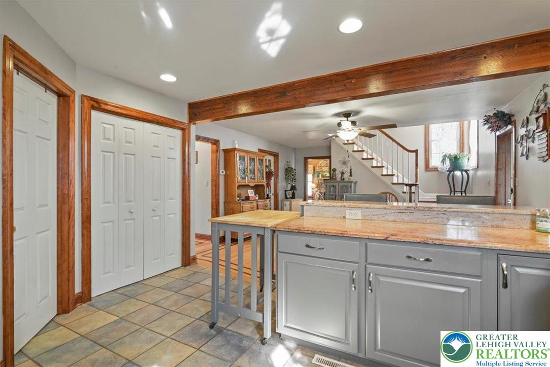 118 Hollow Drive Stroudsburg, PA 18360 - Photo 14 of 45 a large kitchen with granite countertop a sink and cabinets