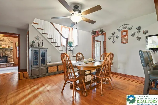 a view of a dining room with furniture wooden floor and chandelier