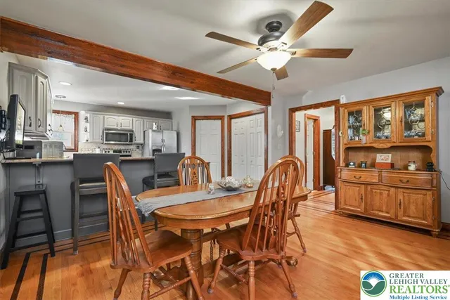 a dining room with furniture and window