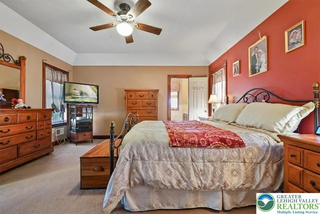 a bed room with a bed and a chandelier