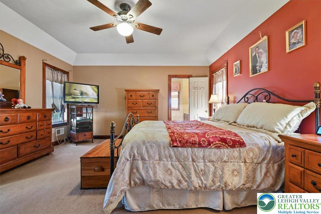 118 Hollow Drive Stroudsburg, PA 18360 - Photo 26 of 45 a bed room with a bed and a chandelier