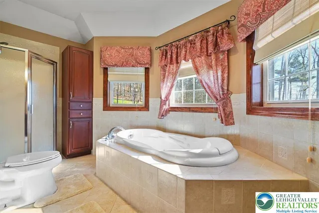 a bathroom with a sink toilet and tub