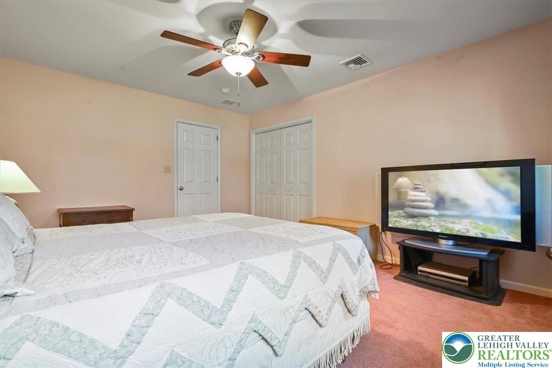 118 Hollow Drive Stroudsburg, PA 18360 - Photo 32 of 45 a bedroom with a bed and a flat screen tv