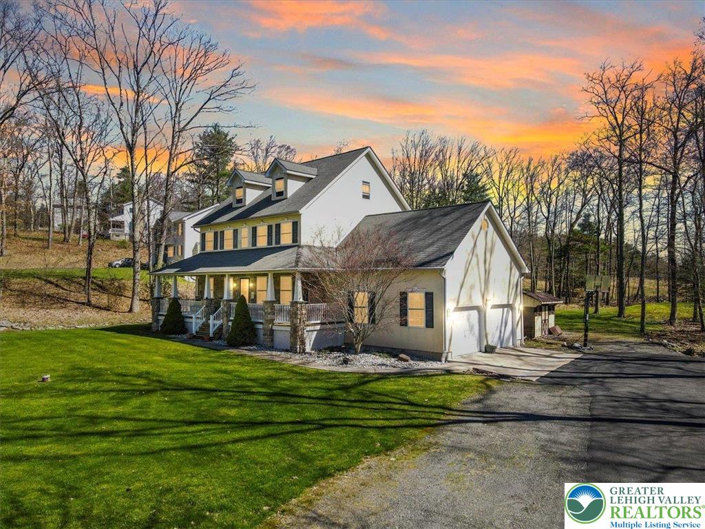 118 Hollow Drive Stroudsburg, PA 18360 - Photo 8 of 45 a front view of a house with a garden and trees