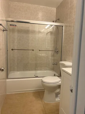 a bathroom with a shower and a toilet