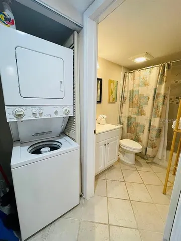 a view of bathroom with a toilet sink and mirror