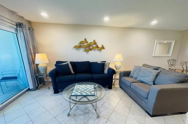 a living room with furniture and a rug