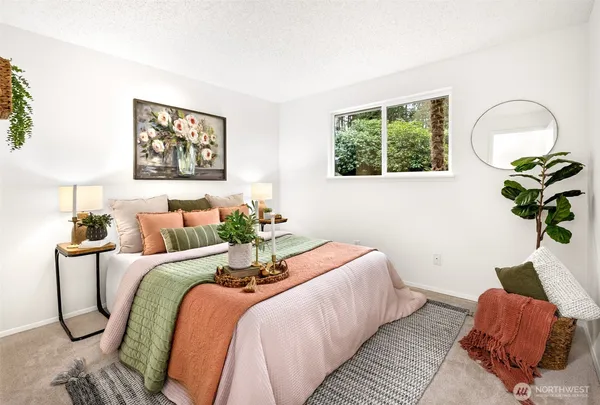 a bedroom with bed and a window
