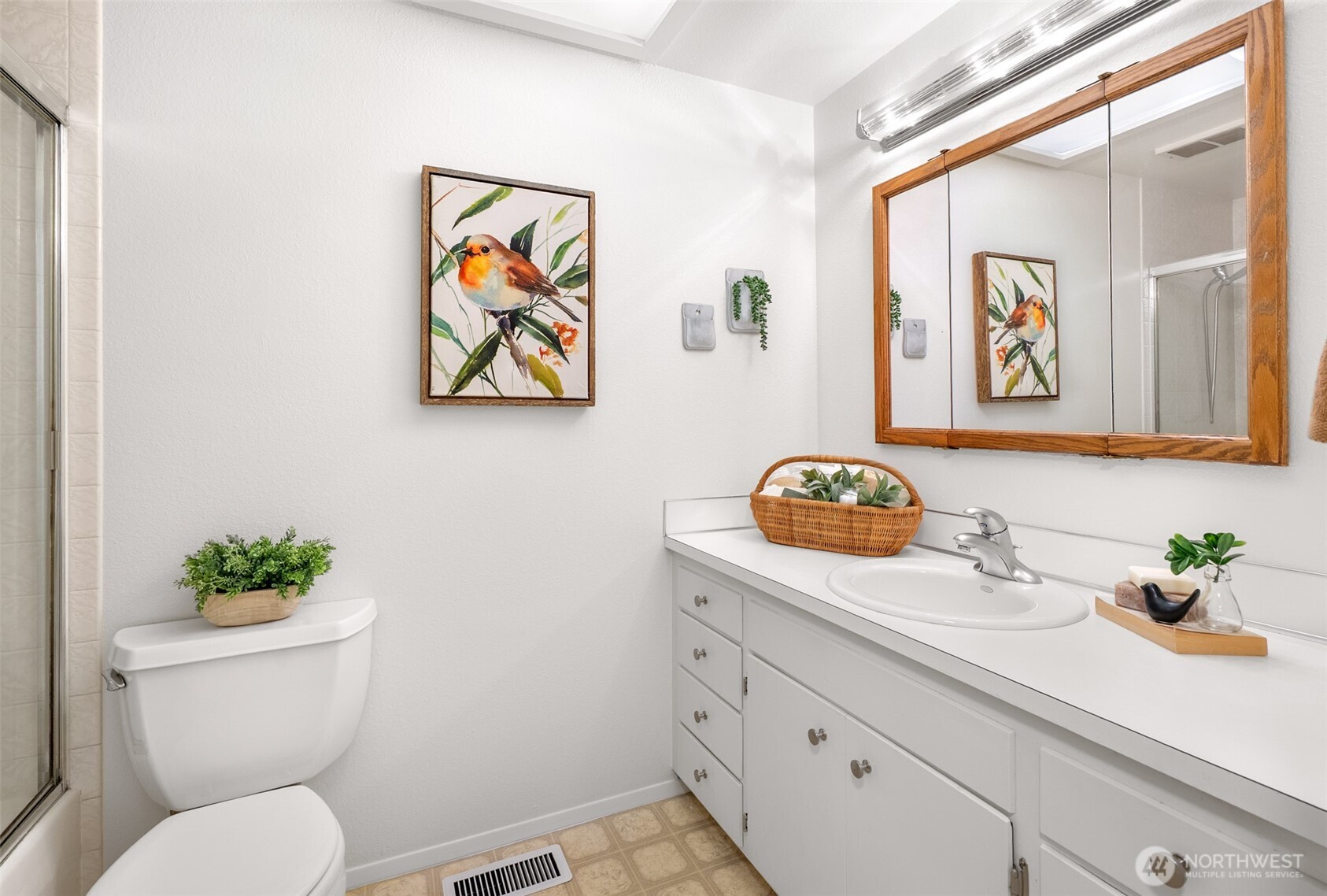 15727 Cascadian Way Bothell, WA 98012 - Photo 13 of 40 a bathroom with a toilet a sink and mirror