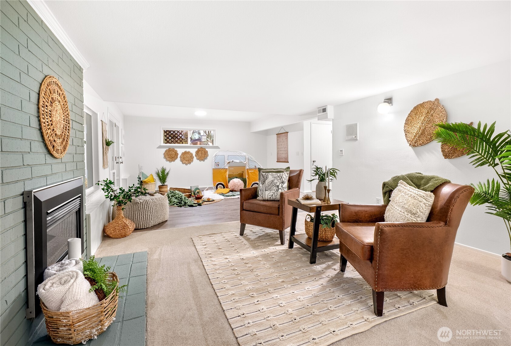 15727 Cascadian Way Bothell, WA 98012 - Photo 15 of 40 a living room with furniture potted plant and a fireplace