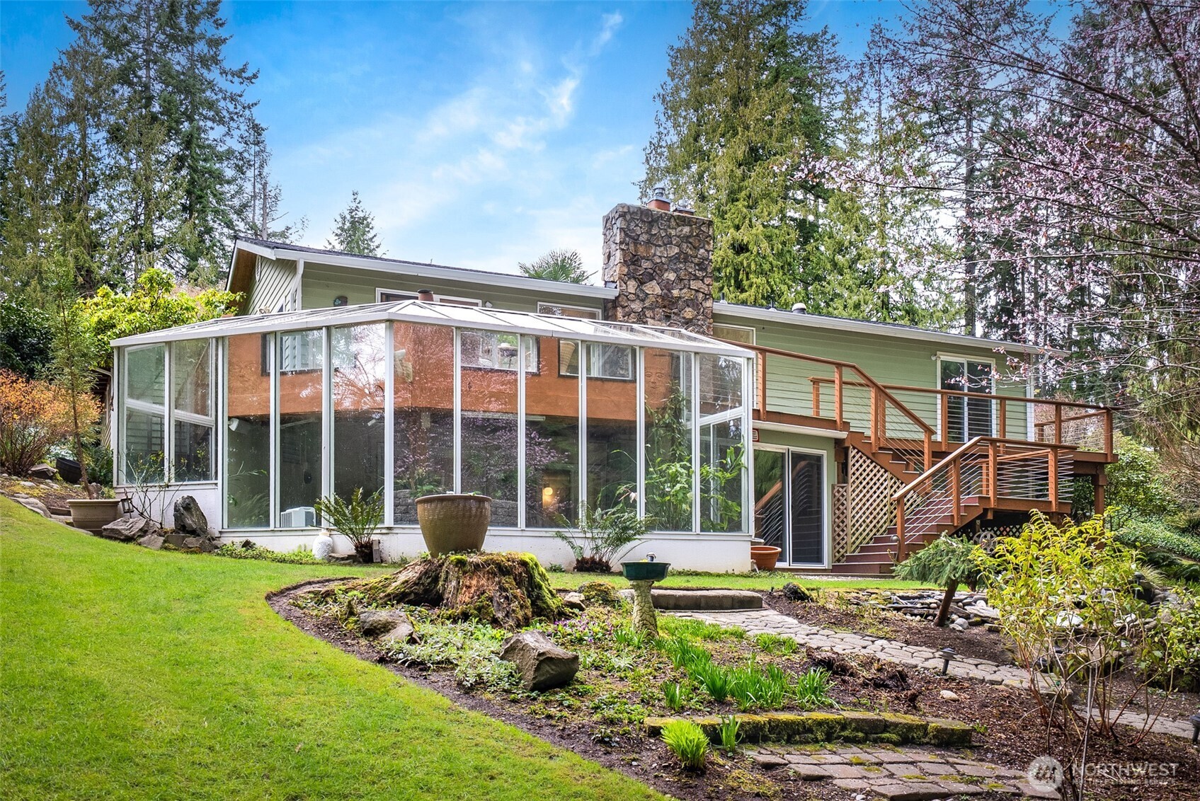 15727 Cascadian Way Bothell, WA 98012 - Photo 21 of 40 a view of a house with backyard sitting area and garden
