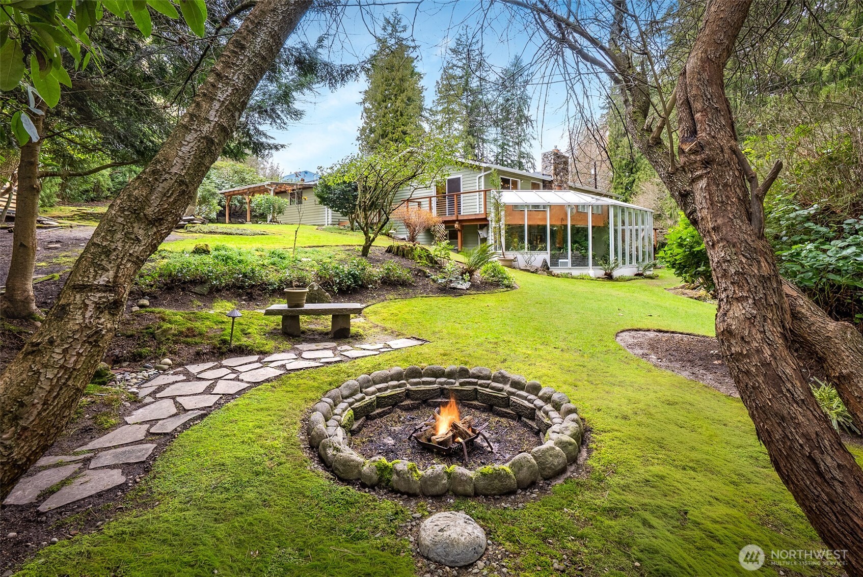 15727 Cascadian Way Bothell, WA 98012 - Photo 26 of 40 a view of a swimming pool with a yard and plants