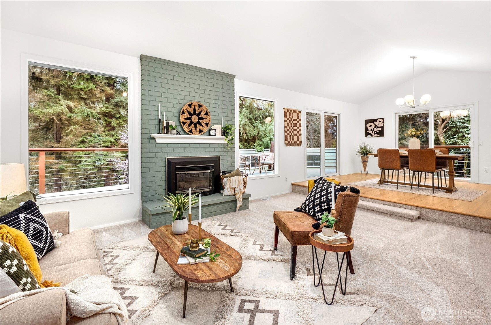 15727 Cascadian Way Bothell, WA 98012 - Photo 3 of 40 a living room with furniture a fireplace and a large window