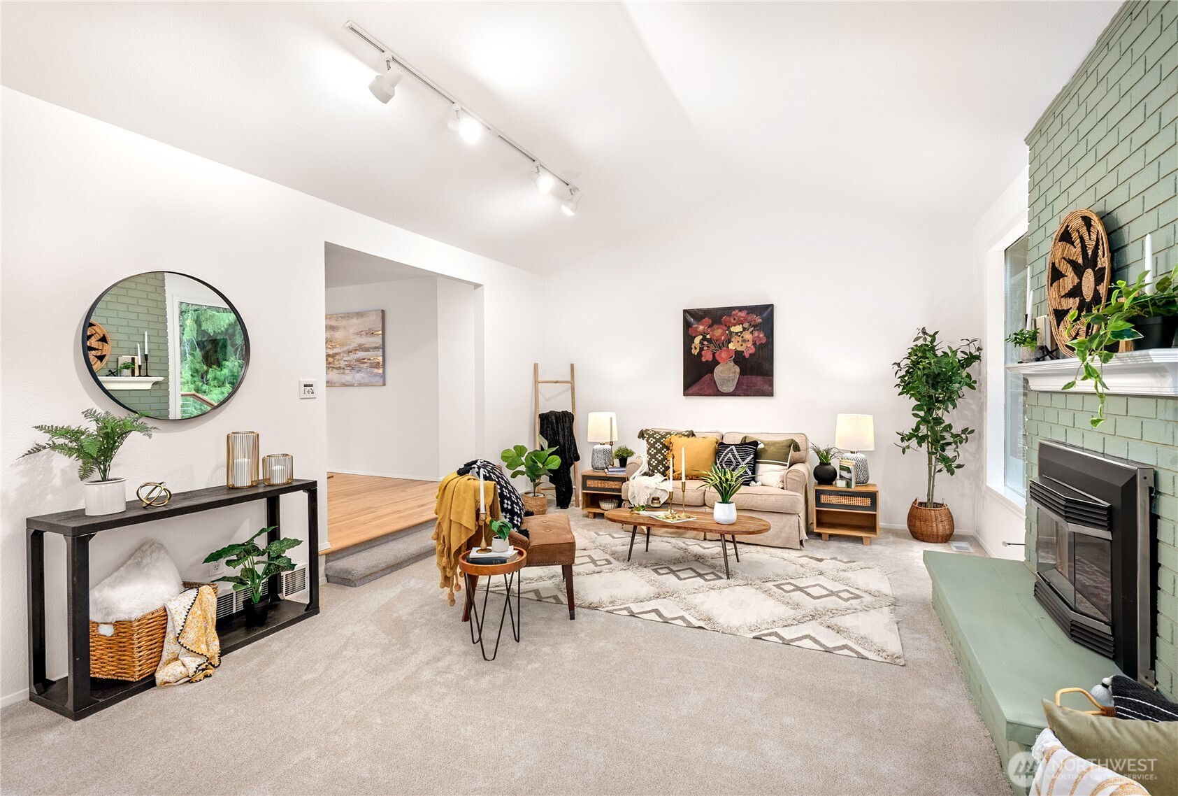 15727 Cascadian Way Bothell, WA 98012 - Photo 4 of 40 a living room with furniture and a fireplace