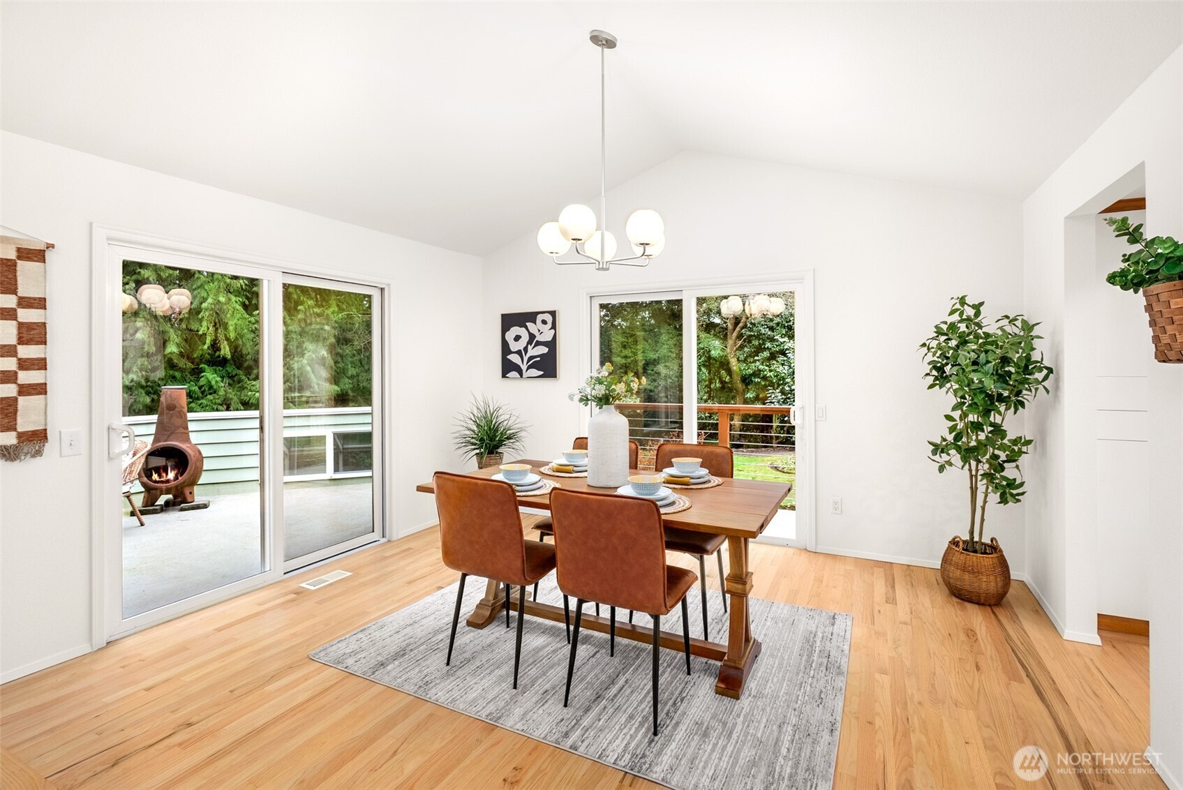 15727 Cascadian Way Bothell, WA 98012 - Photo 5 of 40 a view of a dining room with furniture window and wooden floor