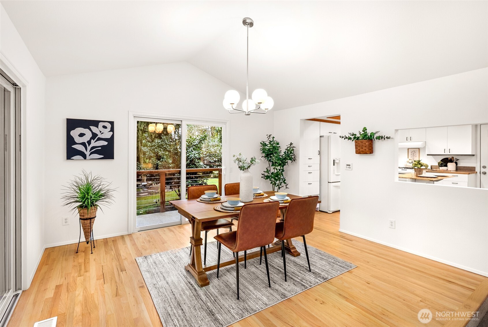 15727 Cascadian Way Bothell, WA 98012 - Photo 6 of 40 a view of a dining room with furniture window and wooden floor