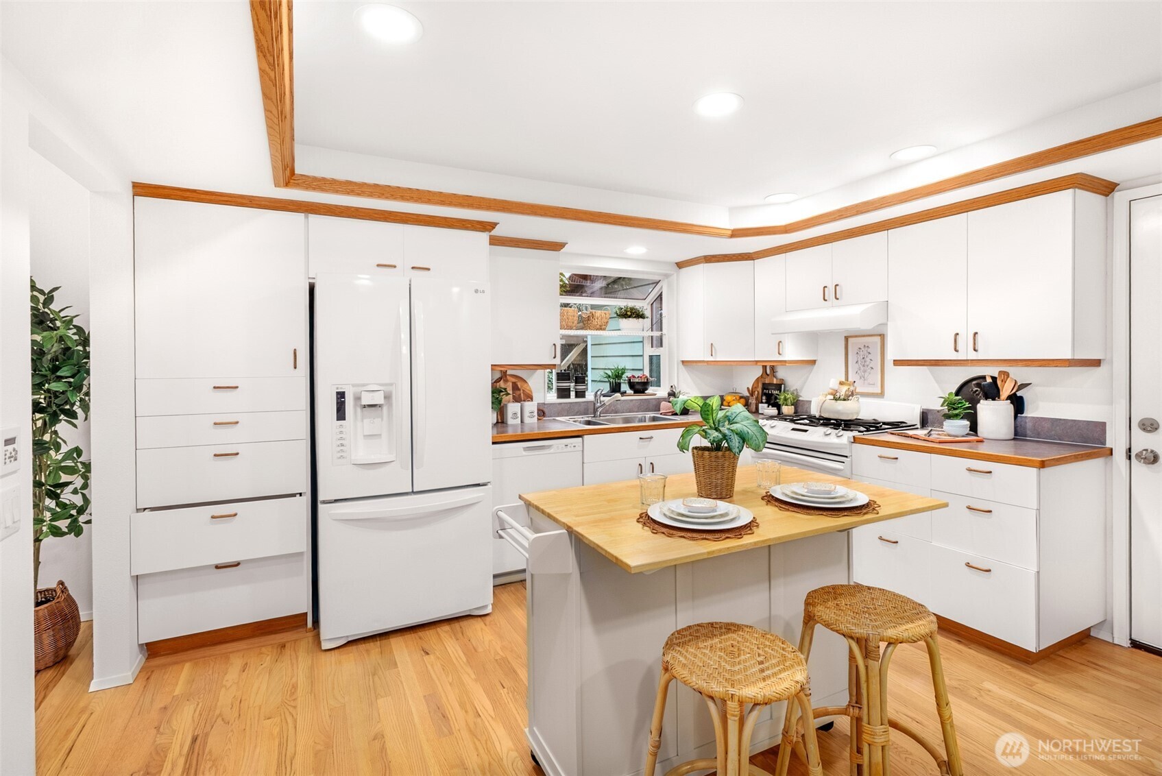 15727 Cascadian Way Bothell, WA 98012 - Photo 8 of 40 a kitchen with stainless steel appliances granite countertop a refrigerator and microwave
