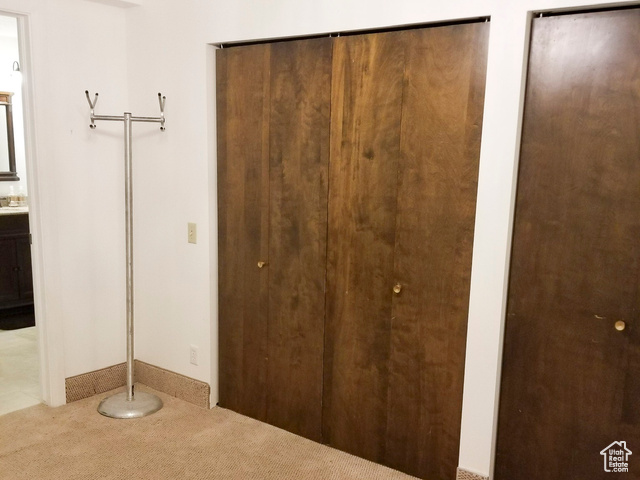 2855 South 1000 West Perry, UT 84302 - Photo 30 of 142 Unfurnished bedroom featuring two closets and carpet flooring