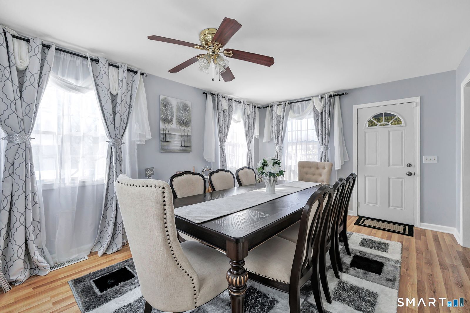 84 Eileen Road West Haven, CT 06516 - Photo 15 of 37 a view of a a dining room with furniture window and wooden floor