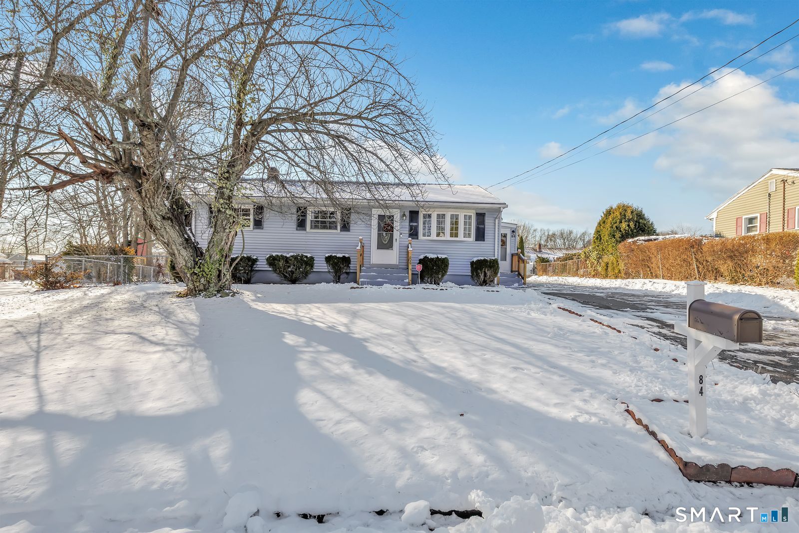 84 Eileen Road West Haven, CT 06516 - Photo 2 of 37 a view of a house with a snow in the background