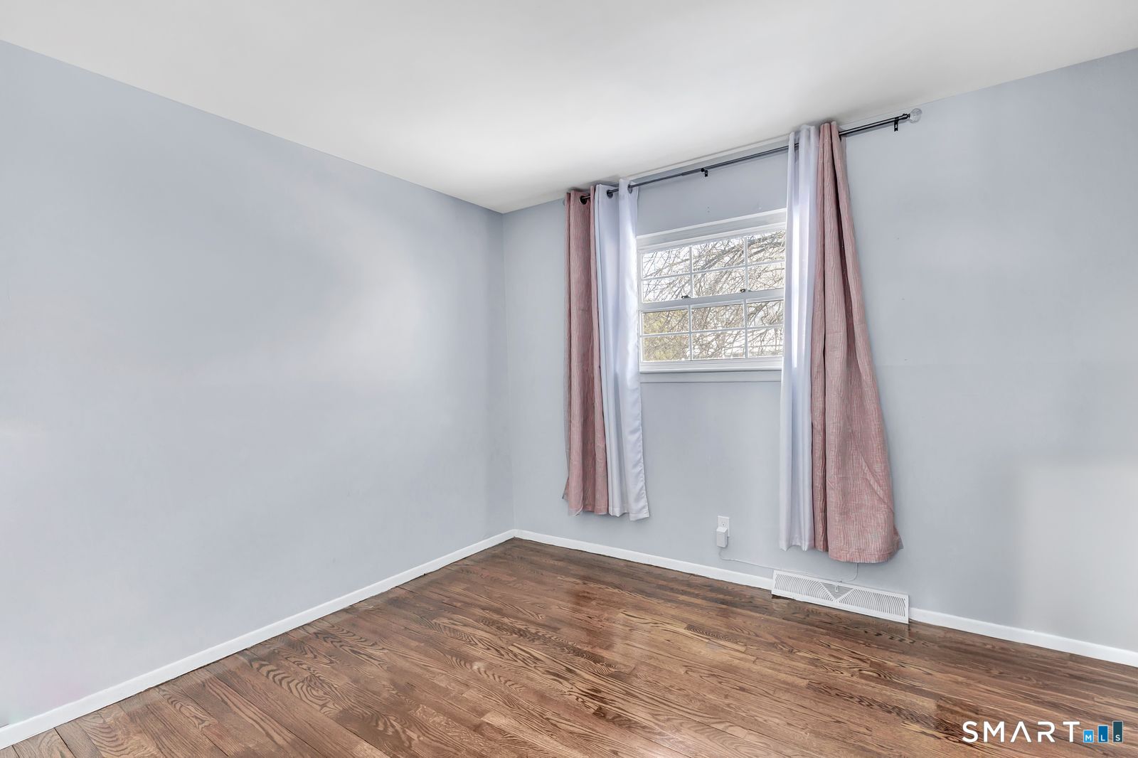 84 Eileen Road West Haven, CT 06516 - Photo 22 of 37 a view of room with window and wooden floor