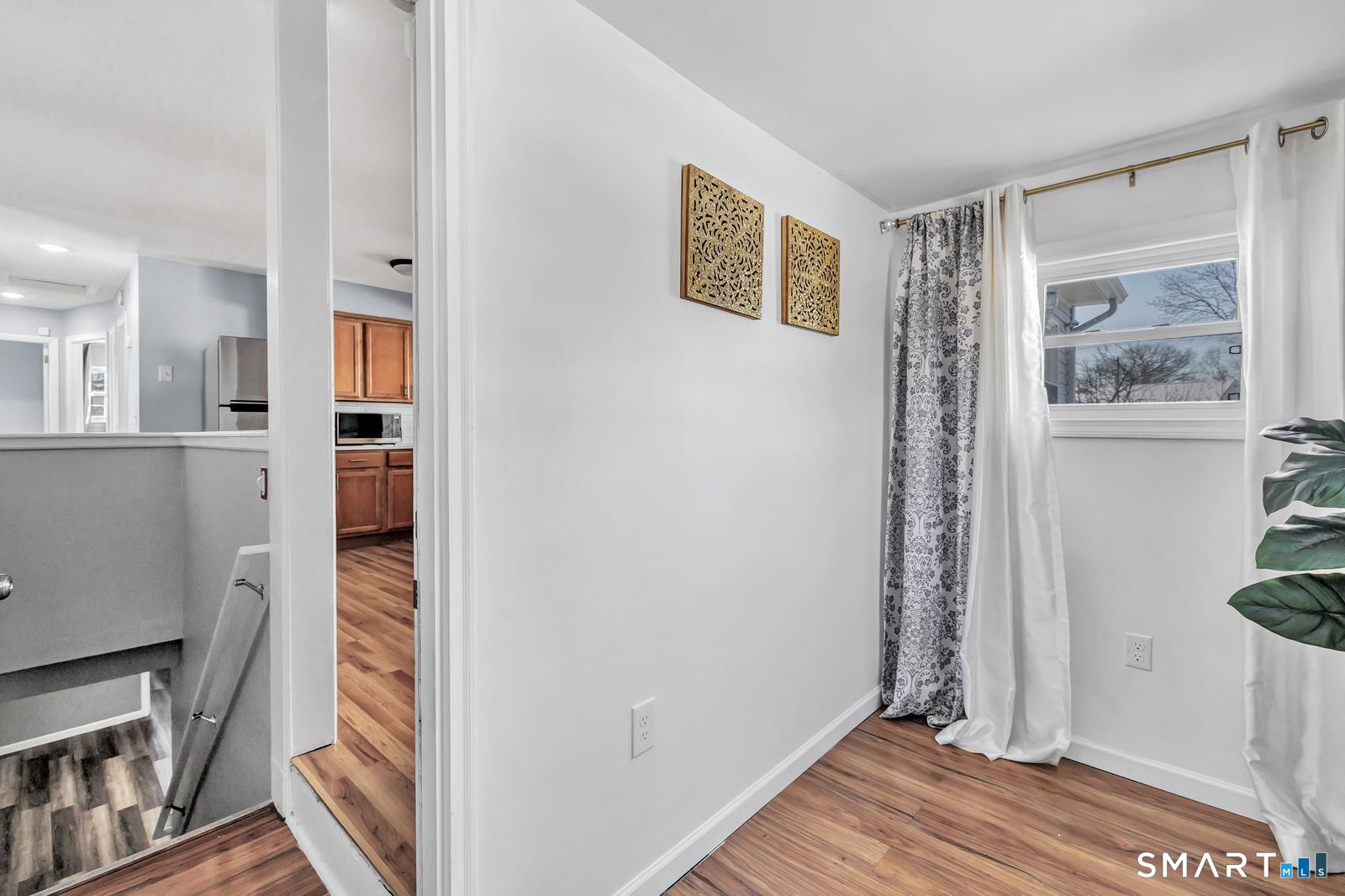 84 Eileen Road West Haven, CT 06516 - Photo 24 of 37 a view of a bedroom with wooden floor and a window