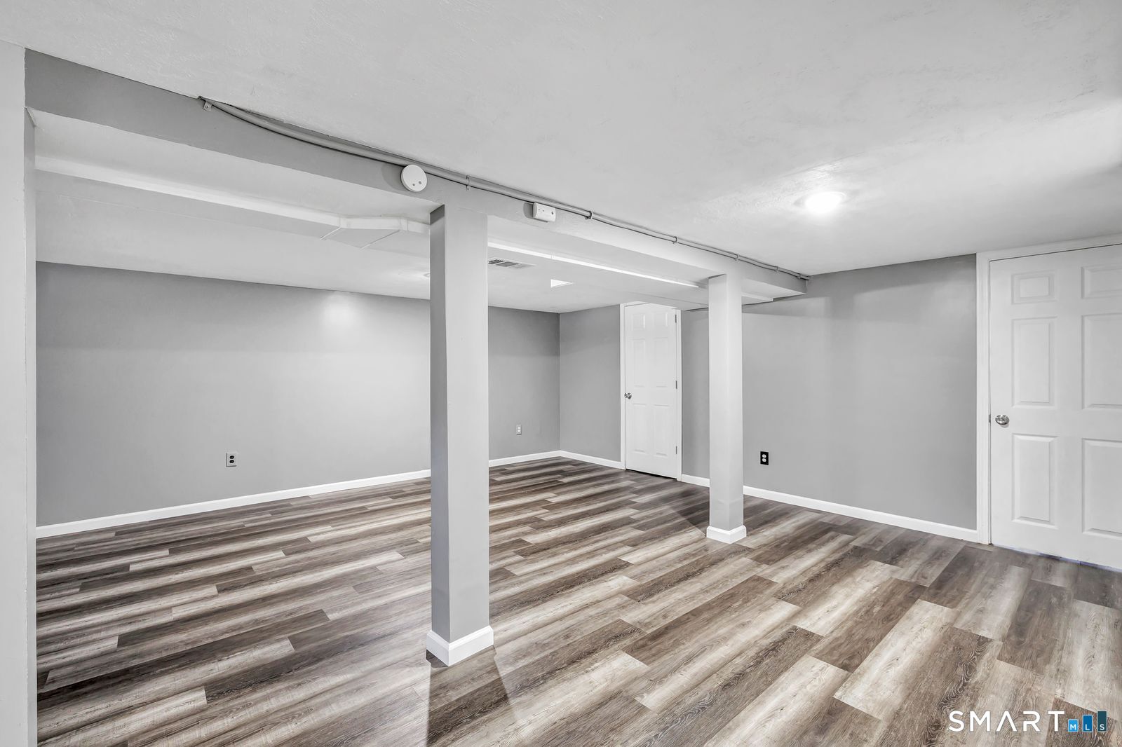 84 Eileen Road West Haven, CT 06516 - Photo 25 of 37 a view of a room with wooden floor and closet
