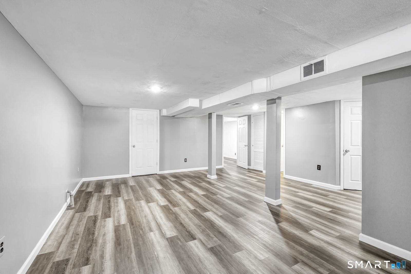 84 Eileen Road West Haven, CT 06516 - Photo 28 of 37 a view of empty room with wooden floor