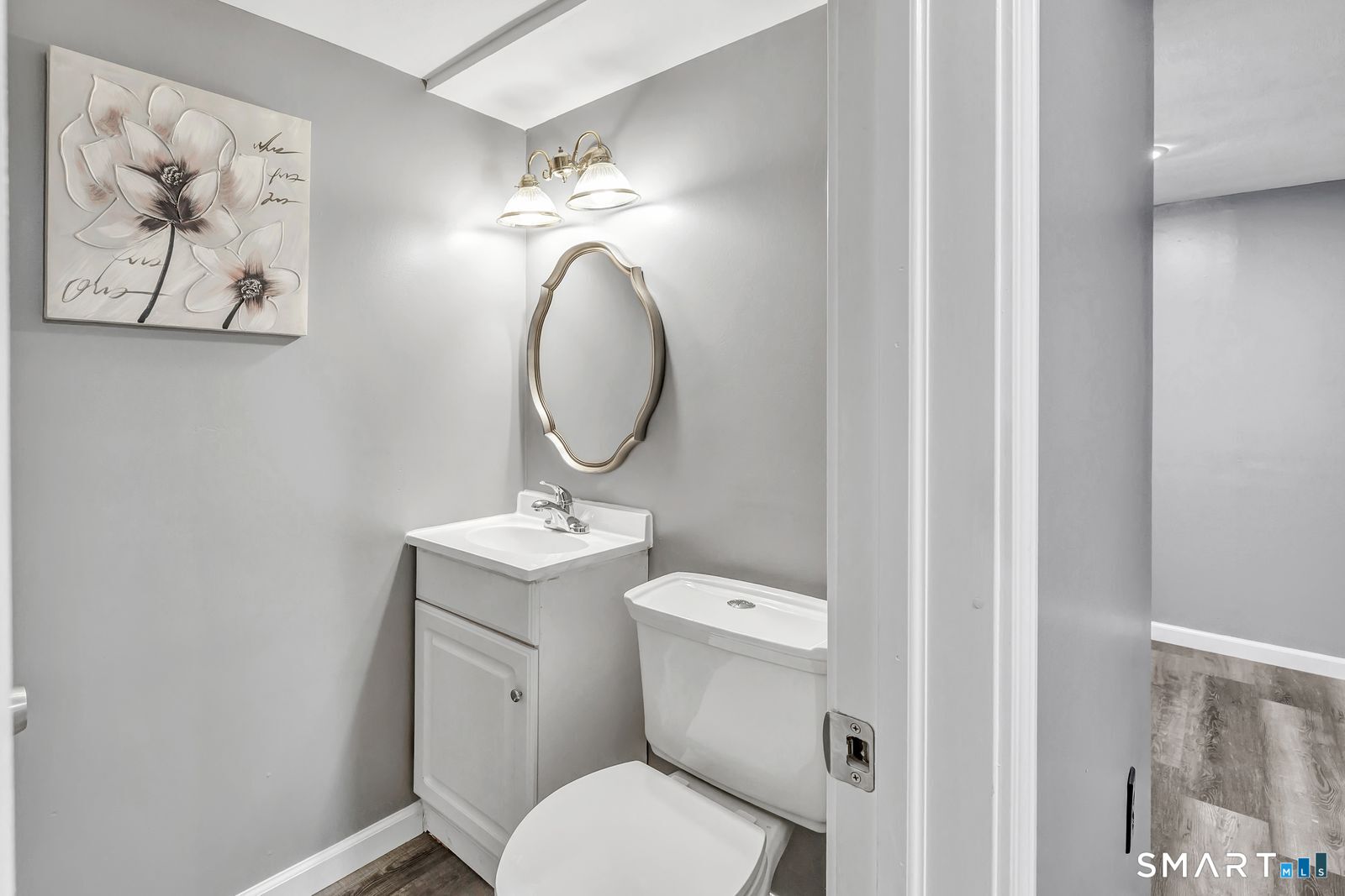 84 Eileen Road West Haven, CT 06516 - Photo 29 of 37 a bathroom with a toilet a sink and mirror