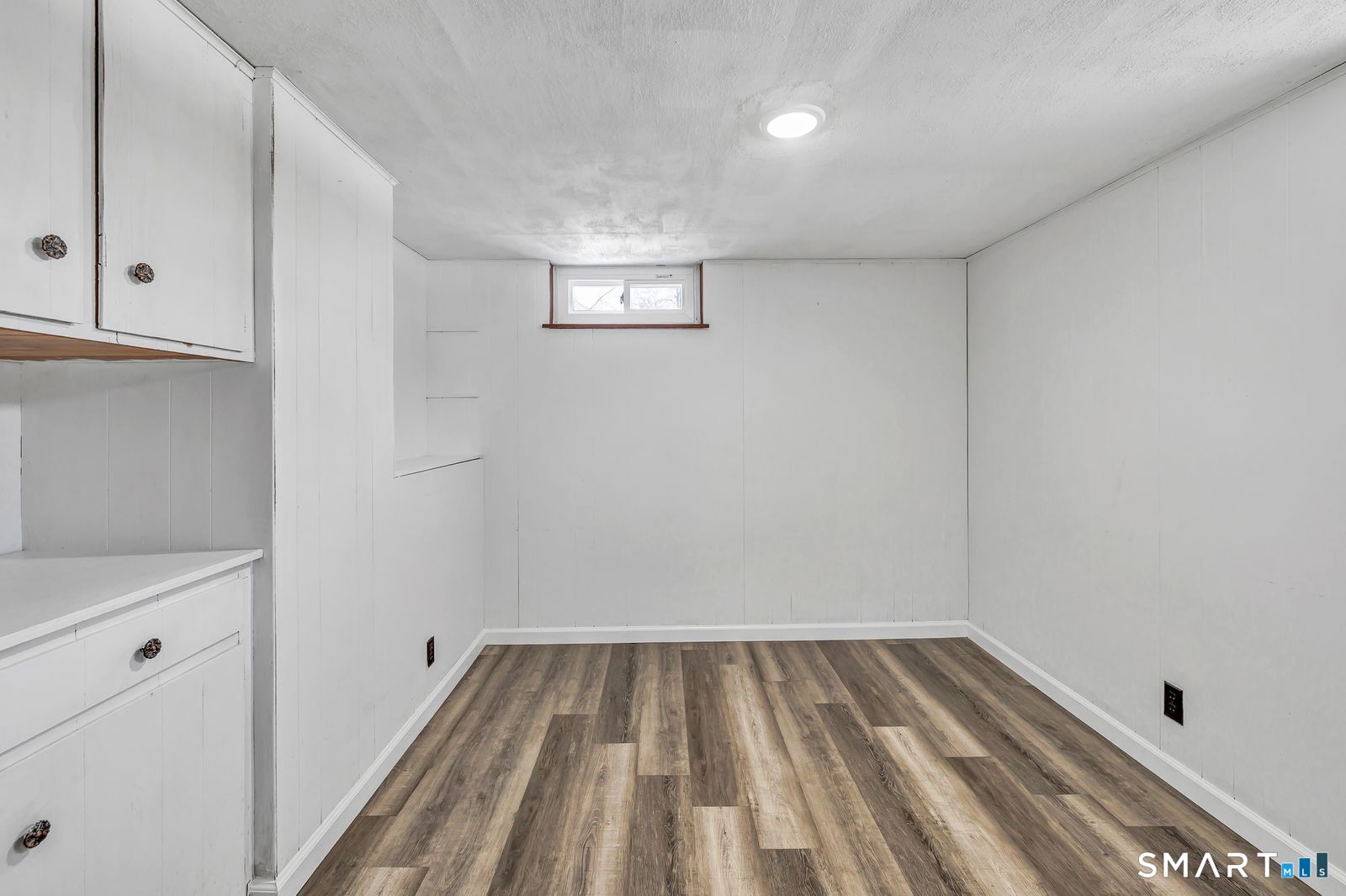 84 Eileen Road West Haven, CT 06516 - Photo 30 of 37 a view of a room with wooden floor