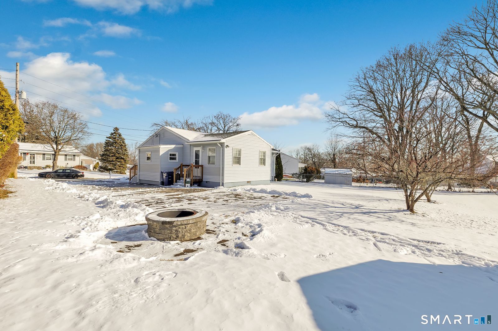 84 Eileen Road West Haven, CT 06516 - Photo 36 of 37 a view of a house with snow on the road