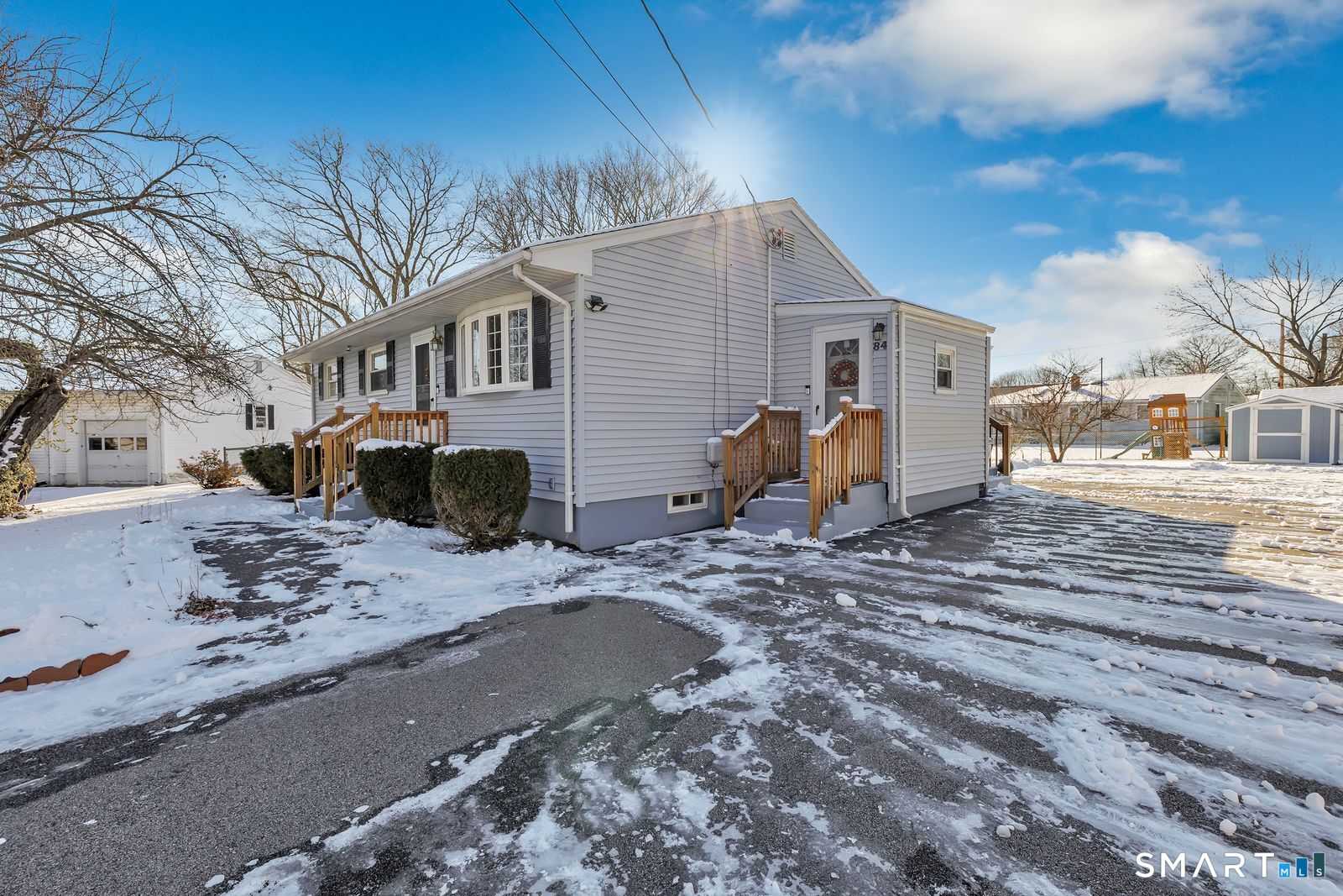 84 Eileen Road West Haven, CT 06516 - Photo 4 of 37 a view of a house with a snow