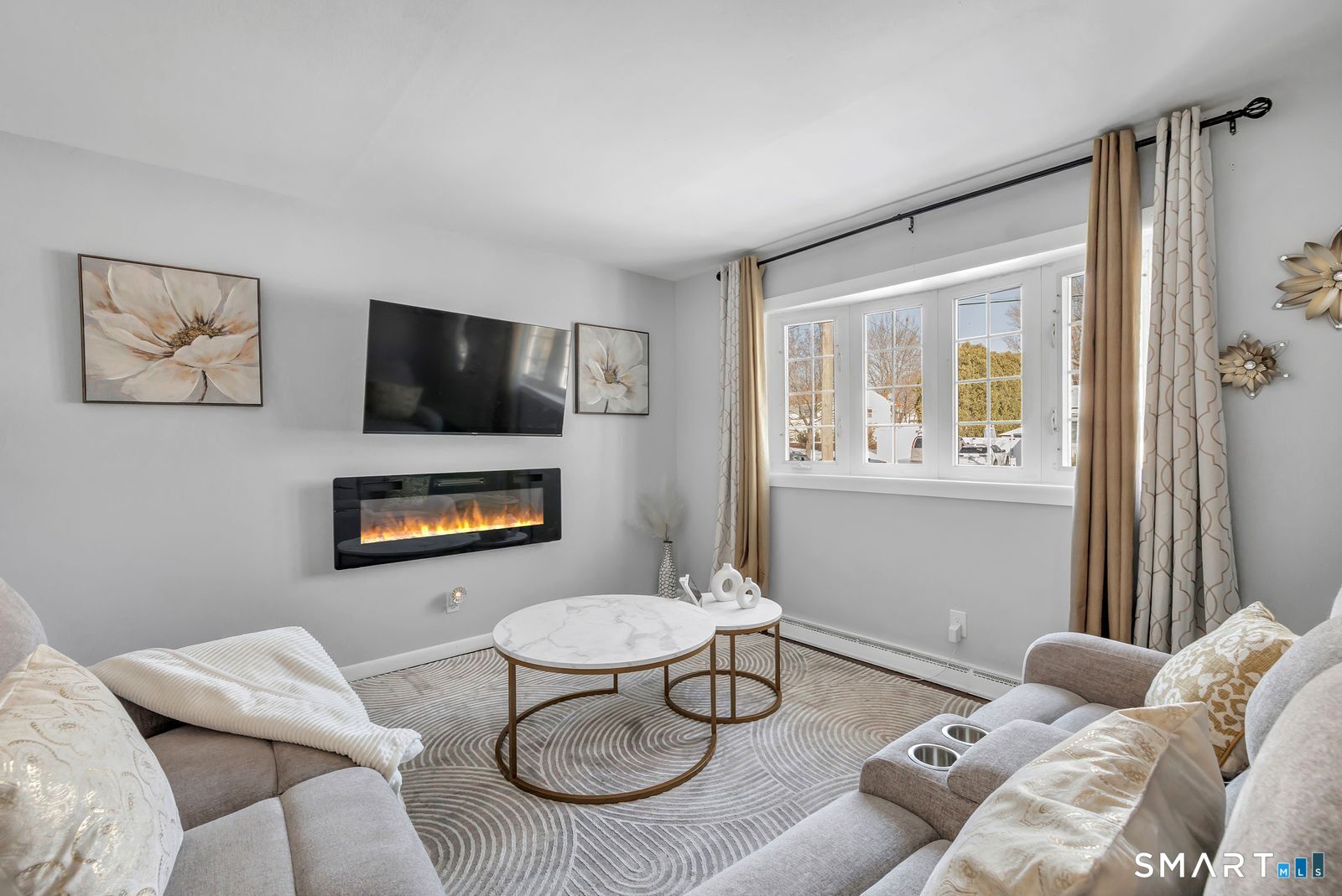 84 Eileen Road West Haven, CT 06516 - Photo 5 of 37 a living room with furniture a couch and a flat screen tv