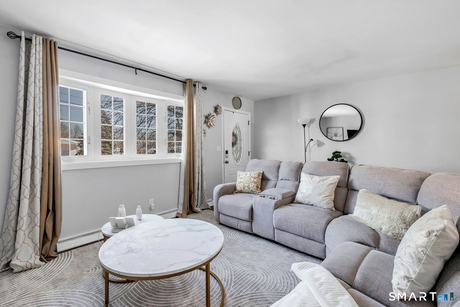 84 Eileen Road West Haven, CT 06516 - Photo 6 of 37 a living room with furniture and a large window