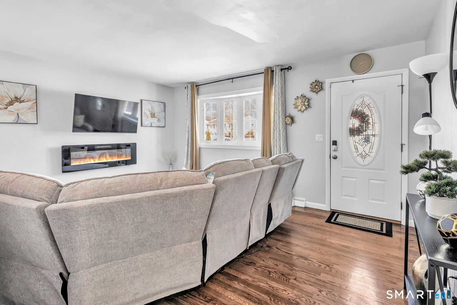 84 Eileen Road West Haven, CT 06516 - Photo 8 of 37 a living room with furniture and a flat screen tv