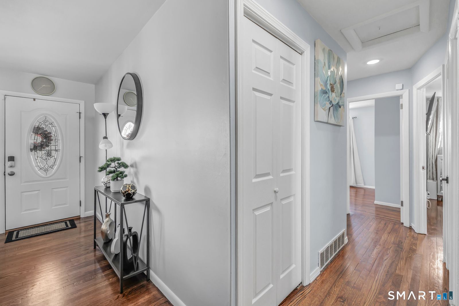 84 Eileen Road West Haven, CT 06516 - Photo 9 of 37 a view of a hallway with wooden floor and stairs