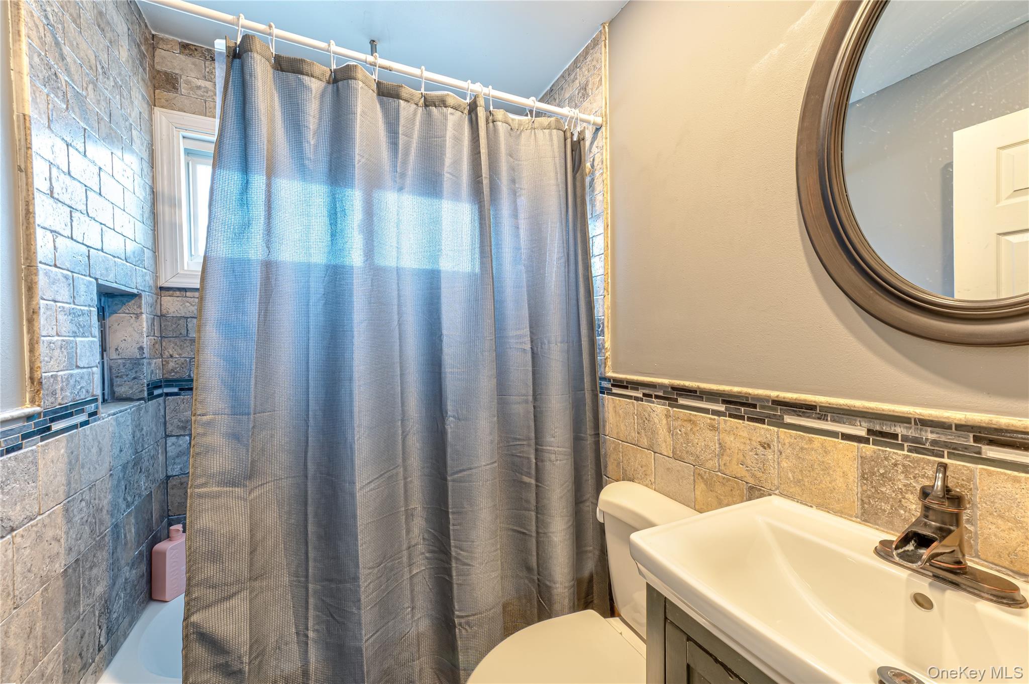 27 Half Mile Road Middle Island, NY 11953 - Photo 13 of 35 Full bath featuring vanity, tile walls, shower / bath combo, and a half tiled walls