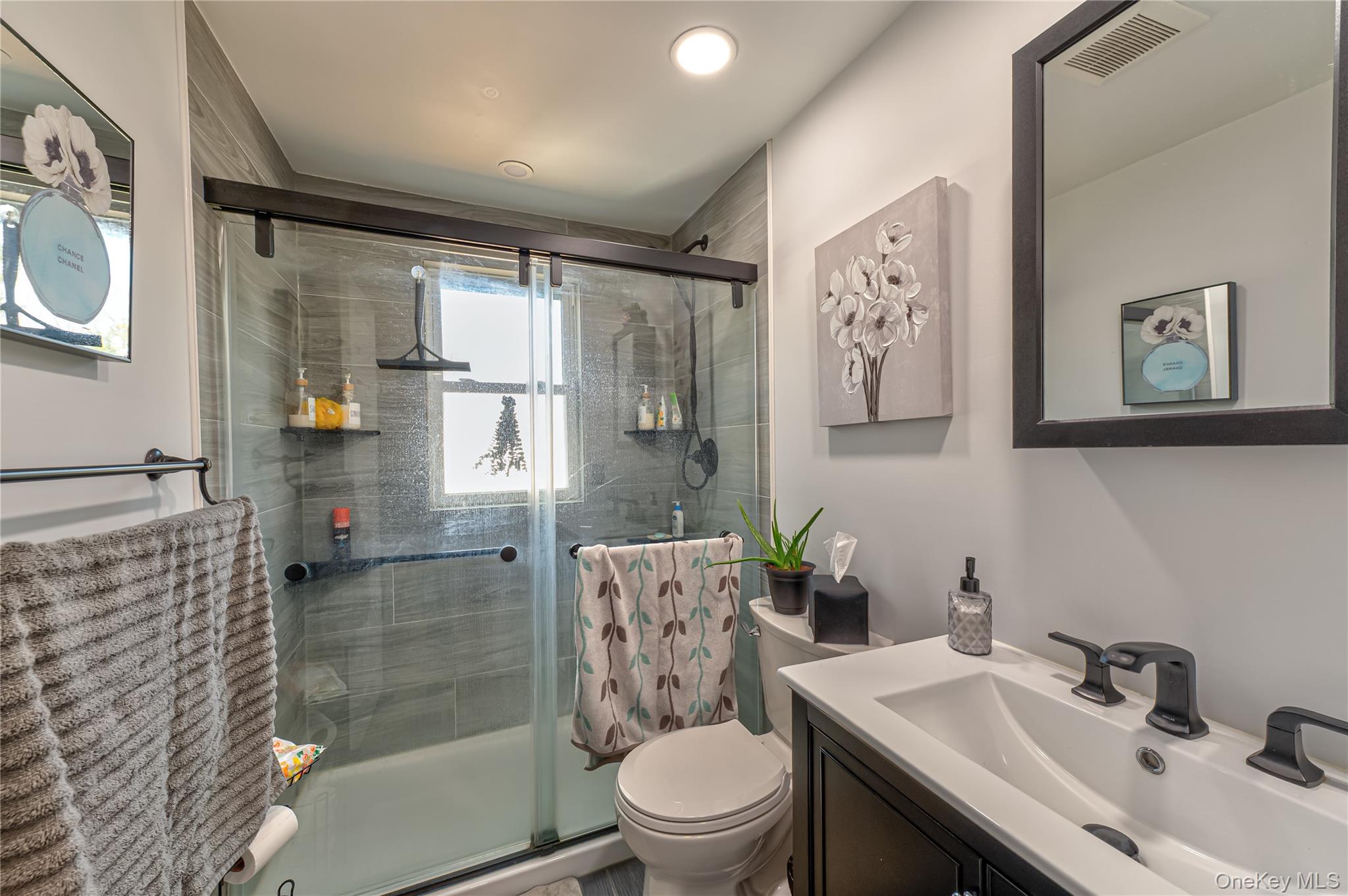 27 Half Mile Road Middle Island, NY 11953 - Photo 18 of 35 Newer Bathroom featuring vanity and a stall shower