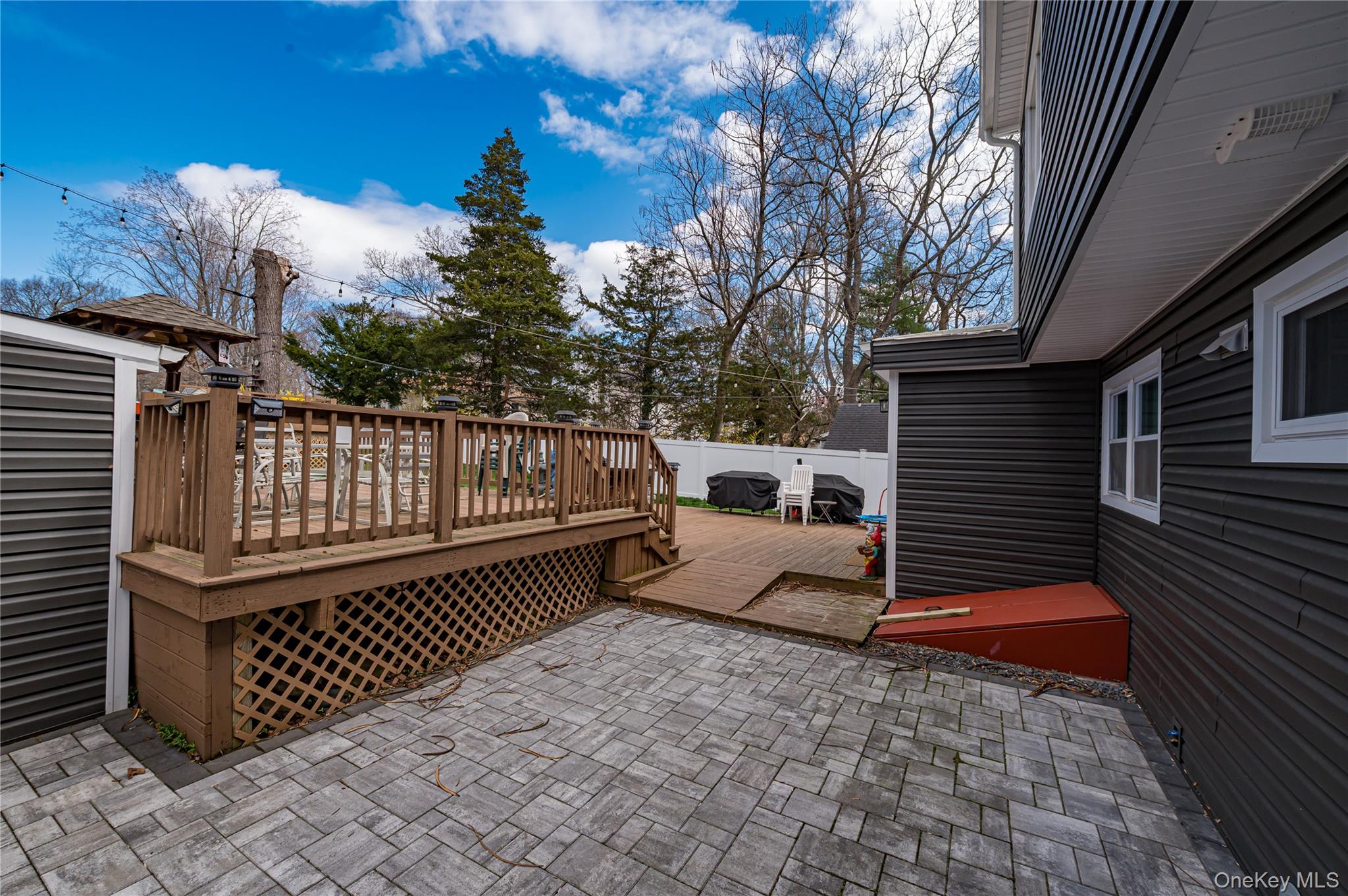27 Half Mile Road Middle Island, NY 11953 - Photo 19 of 35 View of patio featuring a wooden deck Pavers & New Wilco doors