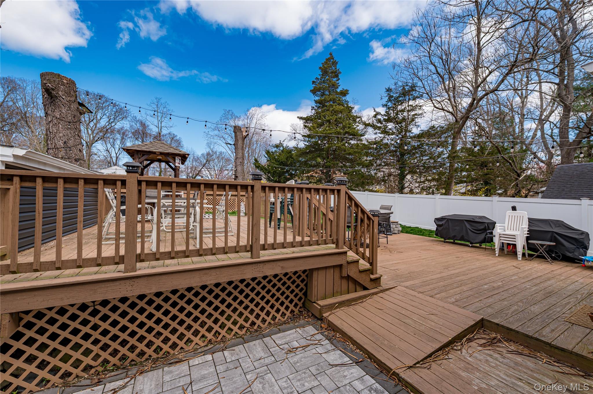 27 Half Mile Road Middle Island, NY 11953 - Photo 20 of 35 Deck featuring area for grilling, and a Fully fenced backyard