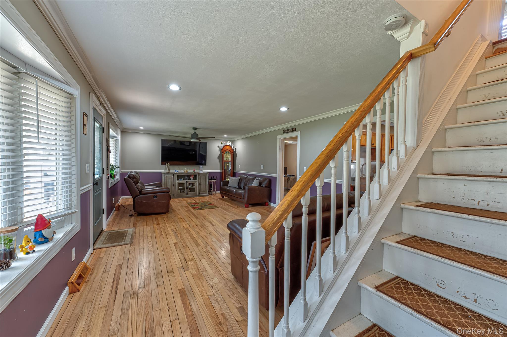 27 Half Mile Road Middle Island, NY 11953 - Photo 7 of 35 Stairs with ornamental molding, hardwood / wood-style floors, ceiling fan, and recessed lighting