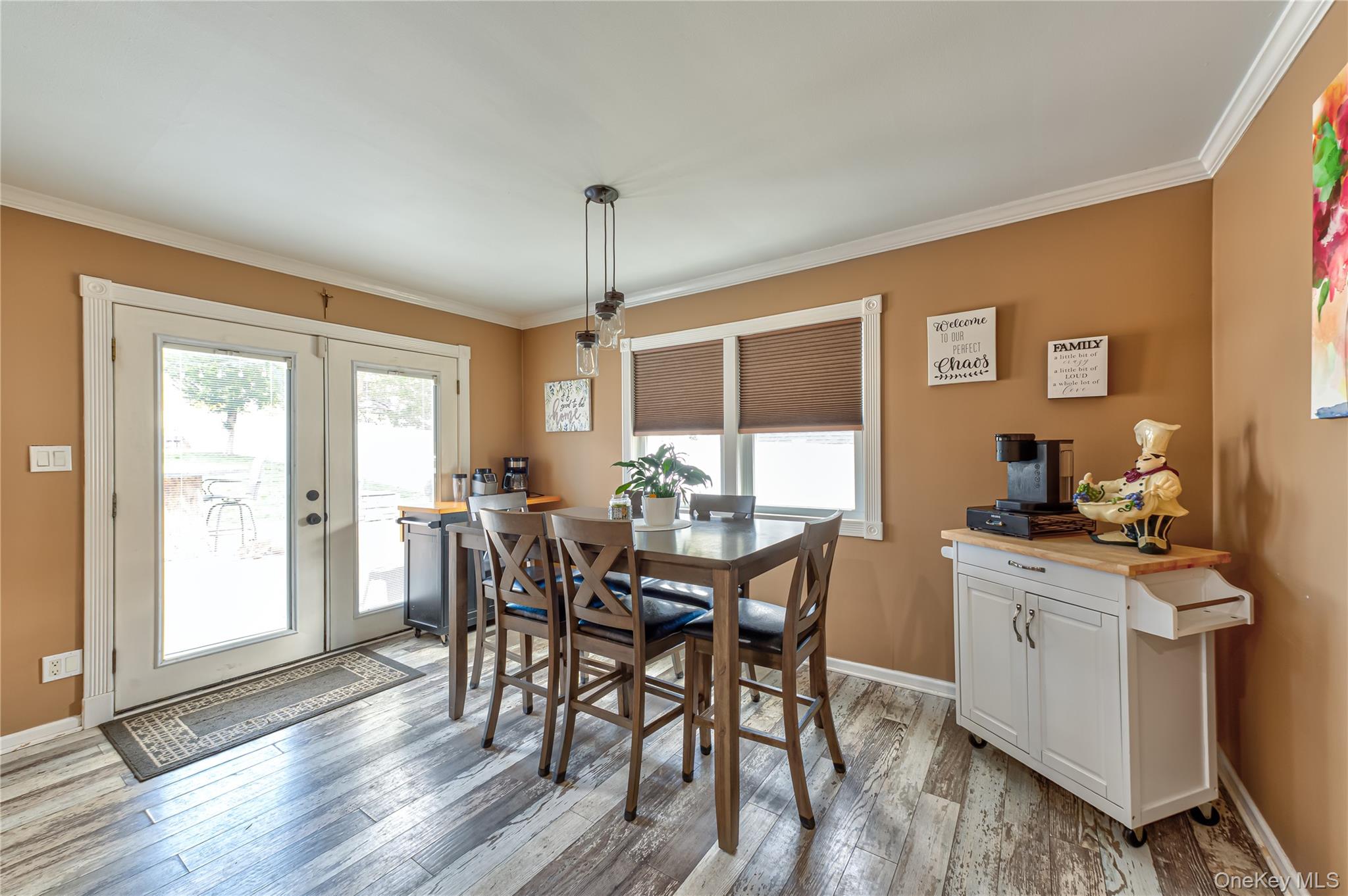 27 Half Mile Road Middle Island, NY 11953 - Photo 8 of 35 Dining room featuring french doors, ornamental molding, and flooring