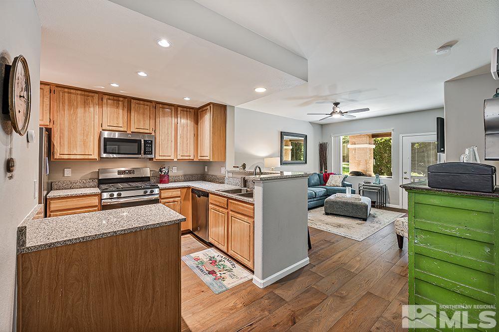 900 S, Unit 2312 Reno, NV 89521 - Photo 3 of 20 a kitchen with stainless steel appliances granite countertop a refrigerator stove and sink