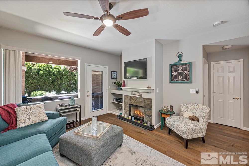 900 S, Unit 2312 Reno, NV 89521 - Photo 8 of 20 a living room with furniture fireplace and a large window
