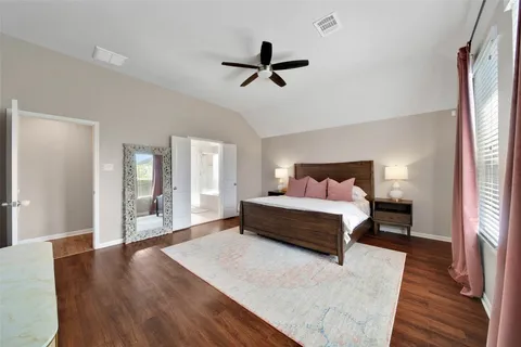 a view of walk in closet with clothes