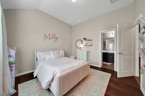 a bathroom with a double vanity sink toilet and shower